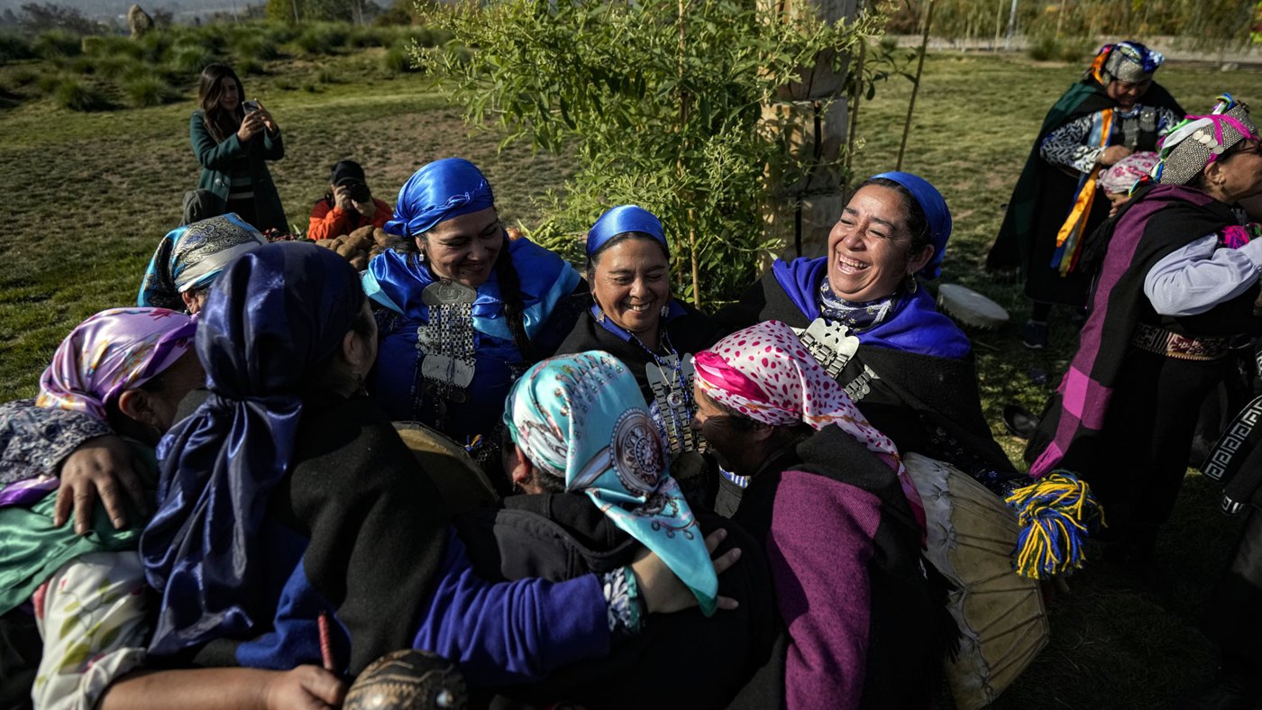 Mapuche women sharing a celebration outdoors in Chile